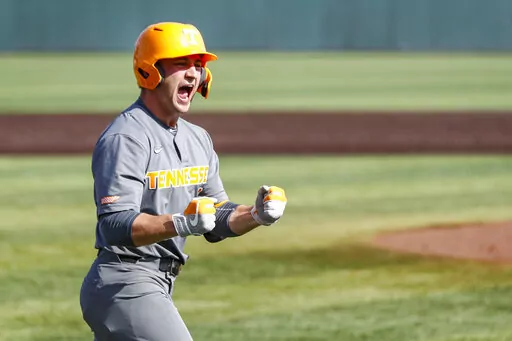 FILE -Tennessee outfielder Evan Russell (6) reacts to hitting a home run during an NCAA college baseball super regional game against LSU Sunday, June 13, 2021, in Knoxville, Tenn. Tennessee's Evan Russell has been cleared to play in an NCAA Tournament regional game against Campbell on Saturday, June 4, 2022 and the school said it expects an apology from ESPN after one of its announcers said the catcher had failed a test for performance enhancing drugs.(AP Photo/Wade Payne, File)