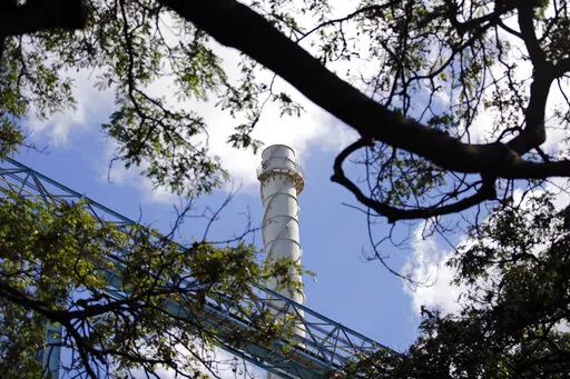The AES Corporation coal-fired power plant in Kapolei, Hawaii is shown on Thursday, Aug. 18, 2022 during a ceremony to mark the closure of the facility. As Hawaii transitions toward its goal of achieving 100% renewable energy by 2045, the state's last coal-fired power plant closed this week ahead of a state law that bans the use of coal as a source of electricity beginning in 2023. (AP Photo/Caleb Jones)