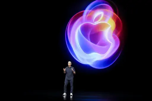 Apple CEO Tim Cook talks on the stage during an announcement of new products at Apple headquarters Monday, Sept. 9, 2024, in Cupertino, Calif. (AP Photo/Juliana Yamada)