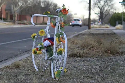 This March 20, 2025 photo shows a memorial ghost bike near the spot where Scott Dwight Habermehl was struck and fatally injured in May 2024 while biking to work at Sandia National Laboratories in Albuquerque, N.M. (AP Photo/Susan Montoya Bryan)