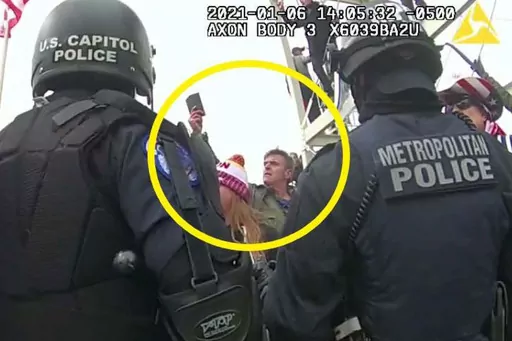 This image from Washington Metropolitan Police Department body-worn video, released and annotated by the Justice Department in the statement of facts supporting an arrest warrant for Jay James Johnston, shows Johnston, circled in yellow, at the U.S. Capitol on Jan. 6, 2021, in Washington. Johnston, the actor known for his roles on the comedy television shows "Bob's Burgers" and "Mr. Show with Bob and David" has been arrested on charges that he joined a mob of Donald Trump supporters in confronti