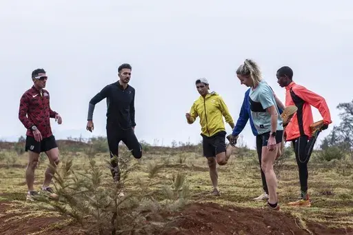 Maltese athletes in the company of locals train along the Iten-Kaptagat road in Iten, Elgeyo Marakwet County, Kenya on Friday, Jan. 31, 2025. (AP Photo/Peter Njuguna)