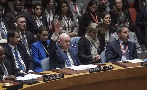 Russia's United Nations Ambassador Vasily Nebenzya raises his hand as he votes against a new U.S. resolution over the conflict between Israel and Palestinians, which was vetoed in the U.N. Security Council, Wednesday, Oct. 25, 2023 at U.N. headquarters. (AP Photo/Bebeto Matthews)