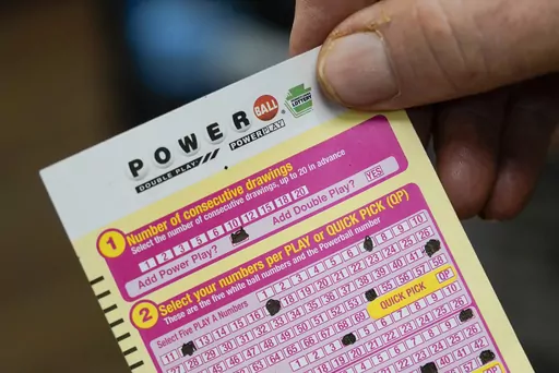 A person shows his scan card for their personal selection numbers for a ticket for a Powerball drawing on Nov. 7, 2022 in Renfrew, Pa. An $835 million Powerball jackpot will be up for grabs Wednesday, Sept. 27, 2023, for players willing to risk a couple dollars and brave incredibly long odds.(AP Photo/Keith Srakocic, File)