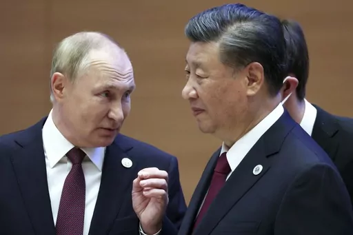 Russian President Vladimir Putin, left, gestures while speaking to Chinese President Xi Jinping during the Shanghai Cooperation Organization (SCO) summit in Samarkand, Uzbekistan, Sept. 16, 2022. China said Friday, March 17, 2023, President Xi will visit Russia from Monday, March 20, to Wednesday, March 22, 2023, in an apparent show of support for Russian President Putin amid sharpening east-west tensions over the conflict in Ukraine. (Sergei Bobylev, Sputnik, Kremlin Pool Photo via AP, File)