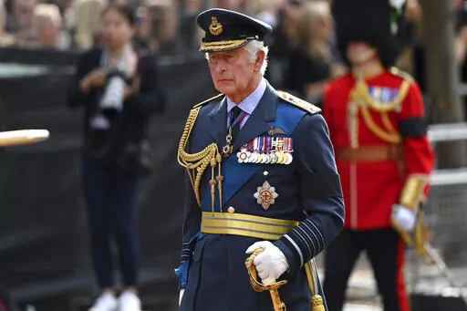 Britain's King Charles III walks behind the coffin during the procession for Queen Elizabeth II, in London, Wednesday, Sept. 14, 2022. The Queen will lie in state in Westminster Hall for four full days before her funeral on Monday Sept. 19. (Kate Green/Pool Photo via AP)