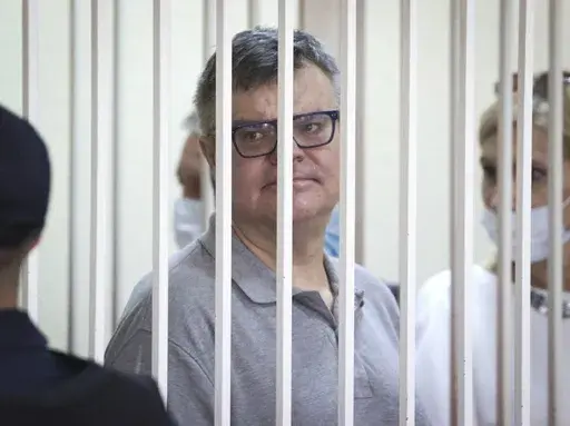 Viktar Babaryka, a former presidential hopeful, stands inside a defendants’ cage during his trial in Minsk, Belarus, on July 6, 2021. (Ramil Nasibulin/BelTA Pool Photo via AP, File)