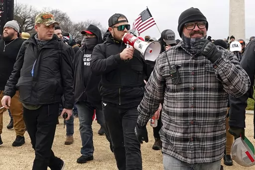 Proud Boys members including Zachary Rehl, left, Ethan Nordean, center, and Joseph Biggs, walk toward the U.S. Capitol in Washington, in support of President Donald Trump on Jan. 6, 2021. (AP Photo/Carolyn Kaster, fFle)