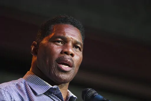Herschel Walker, Republican candidate for U.S. Senate for Georgia, speaks at a primary watch party on May 23, 2022, at the Foundry restaurant in Athens, Ga. A woman who said Walker paid for her 2009 abortion is the mother of one of his children, according to a new report released Wednesday, Oct. 5, 2022, undercutting the Republican Senate candidate's claims that he did not know who she was. (AP Photo/Akili-Casundria Ramsess, File)