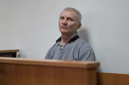 Alexei Moskalyov sits in a courtroom in Yefremov, Tula region, some 300 kilometers (186 miles) south of Moscow, Russia, Monday, March 27, 2023. A court in Russia on Tuesday convicted a single father over social media posts criticizing the war in Ukraine and sentenced him to two years in prison — a case brought to the attention of authorities by his daughter's drawings against the invasion at school, according to the man's lawyer and local activists. The 54-year-old Moskalyov, a single father o