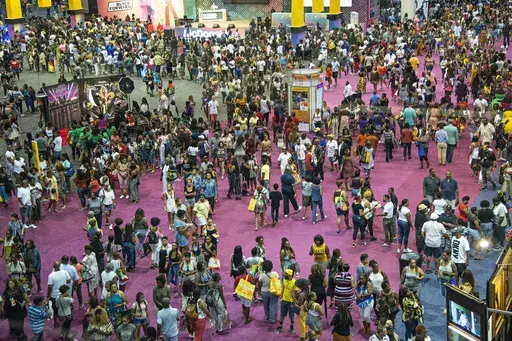 Attendees walk around the 2018 Essence Festival at the Ernest N. Morial Convention Center on Friday, July 6, 2018, in New Orleans. The 30th Essence Festival of Culture, celebrating the best of Black culture’s policymakers, thought leaders, creatives, business minds, health experts and musical talent, will take place this Fourth of July weekend, 2024, in New Orleans. (Photo by Amy Harris/Invision/AP, File)