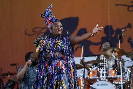 Tarriona "Tank" Ball of Tank and The Bangas performs at the New Orleans Jazz & Heritage Festival, April 28, 2023, at Fair Grounds Race Course in New Orleans. On Sunday, July 7, 2024, Tank and the Bangas will bring its fusion of funk, soul, hip hop, rock and spoken word to the Essence Festival of Culture in New Orleans. (Photo by Amy Harris/Invision/AP, File)