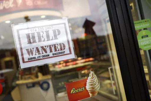 A help wanted sign is shown in a storefront on Nov. 1, 2022, in Bedford, N.Y. The Federal Reserve's move Wednesday, Dec. 14, to raise its key rate by a half-point brought it to a range of 4.25% to 4.5%, the highest level in 14 years. (AP Photo/Julia Nikhinson, File)