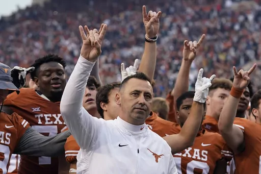 Texas head coach Steve Sarkisian, center, joins his team for the school song following their win over Baylor in an NCAA college football game in Austin, Texas, Friday, Nov. 25, 2022. Texas coach Steve Sarkisian was asked Monday, Aug. 28, 2023, at his weekly news conference about Yormark's recent comment telling Texas Tech coach Joey McGuire that his team “better take care of business” when the Red Raiders play Texas the day after Thanksgiving.(AP Photo/Eric Gay, File)