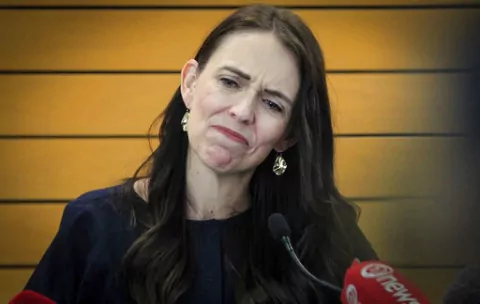 New Zealand Prime Minister Jacinda Ardern grimaces as she announces her resignation at a press conference in Napier, New Zealand Thursday, Jan. 19, 2023. Ardern says that she will not contest this year's general elections. (Warren Buckland/New Zealand Herald via AP)