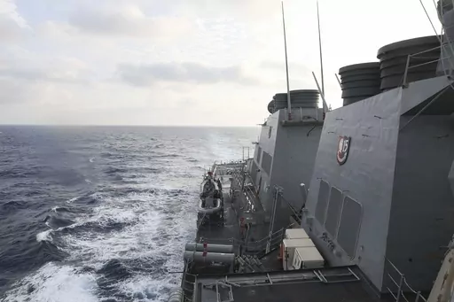 In this photo provided by the U.S. Navy, the Arleigh Burke-class guided-missile destroyer USS Milius (DDG 69) conducts routine underway operations in South China Sea, Friday March 24, 2023. China threatened “serious consequences” Friday, after the U.S. Navy sailed a destroyer around the disputed Paracel Islands in the South China Sea the second day in a row, which Beijing claimed was a violation of its sovereignty and security.(Mass Communication Specialist 1st Class Greg Johnson/U.S. Navy v