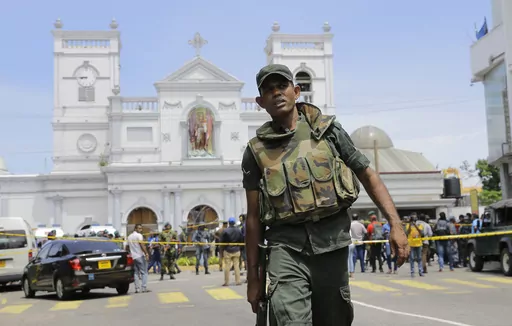 FILE- In this April 21, 2019 file photo, Sri Lankan army soldiers secure the area around St. Anthony's Shrine after a blast on Easter Sunday in Colombo, Sri Lanka. Sri Lanka’s president said Sunday he will appoint a committee chaired by a retired Supreme Court judge to investigate allegations made in a British television report that the South Asian country’s intelligence was complicit in the 2019 Easter Sunday bombings that killed 269 people. (AP Photo/Eranga Jayawardena, File)