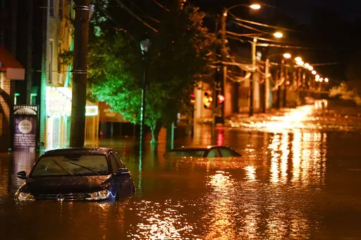 The Manayunk neighborhood in Philadelphia is flooded Thursday, Sept. 2, 2021, in the aftermath of downpours and high winds from the remnants of Hurricane Ida. La Nina, the natural but potent weather event linked to more drought and wildfires in the western United States and more Atlantic hurricanes, is becoming the nation’s unwanted weather guest and meteorologists said the West’s megadrought won’t go away until La Nina does. (AP Photo/Matt Rourke, File)