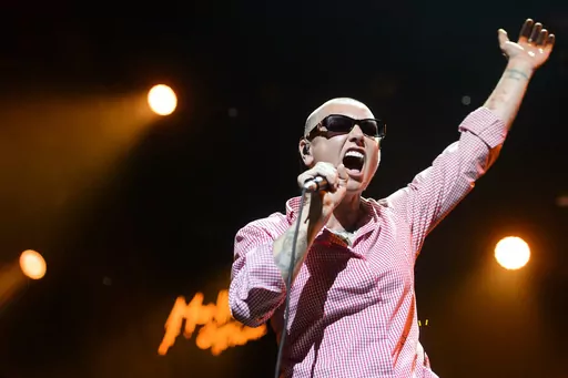 Irish singer Sinead O'Connor performs on the Stravinski Hall stage at the 49th Montreux Jazz Festival, in Montreux, Switzerland on July 4, 2015. O’Connor, the gifted Irish singer-songwriter who became a superstar in her mid-20s but was known as much for her private struggles and provocative actions as for her fierce and expressive music, has died at 56. The singer's family issued a statement reported Wednesday by the BBC and RTE. (Jean-Christophe Bott/Keystone via AP, File)