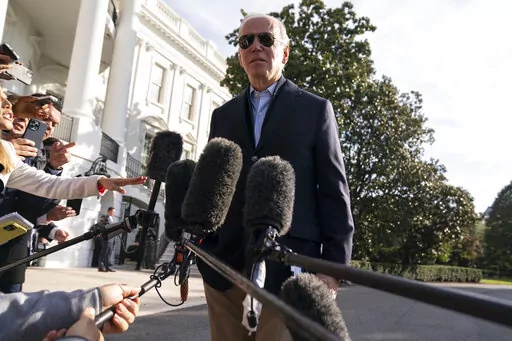 President Joe Biden talks to reporters before boarding Marine One on the South Lawn of the White House, Wednesday, Oct. 12, 2022, in Washington. More U.S. adults are now feeling financially vulnerable amid high inflation. That's a political risk for Biden and his fellow Democrats one month before the midterm elections. (AP Photo/Evan Vucci)