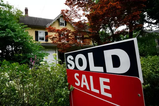 A sale sign stands outside a home in Wyndmoor, Pa., June 22, 2022. One of the nation's largest real estate brokerages has agreed Thursday, Feb. 1, 2024, to pay $70 million as part of a proposed settlement to resolve more than a dozen lawsuits across the country over agent commissions. (AP Photo/Matt Rourke, File)