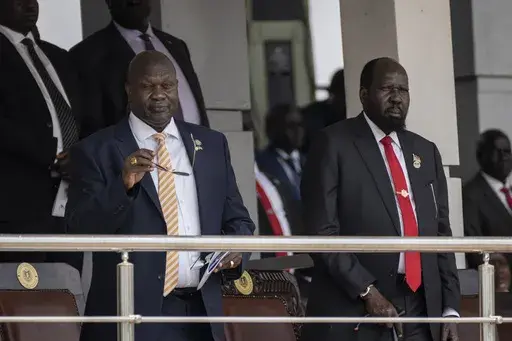 South Sudan's President Salva Kiir, right, and Vice President Riek Machar, left, attend a Holy Mass led by Pope Francis at the John Garang Mausoleum in Juba, South Sudan Sunday, Feb. 5, 2023. (AP Photo/Ben Curtis, File)