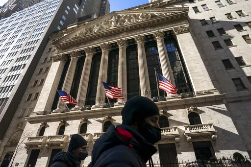 A pedestrian passes the New York Stock Exchange, Monday, Jan. 24, 2022, in New York. The stock market is losing crucial support from the Federal Reserve. Omicron is causing havoc at businesses around the world. And Russia just might be preparing to invade Ukraine, creating more uncertainty and raising the prospect of even higher oil prices. (AP Photo/John Minchillo, File)