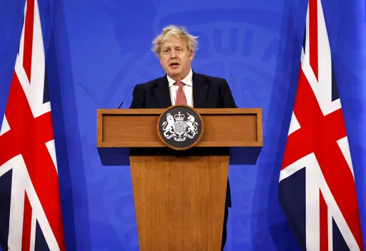 Britain's Prime Minister Boris Johnson speaks during a media briefing in Downing Street, London,  Monday Feb. 21, 2022, to outline the Government's new long-term COVID-19 plan. (Tolga Akmen/Pool via AP)