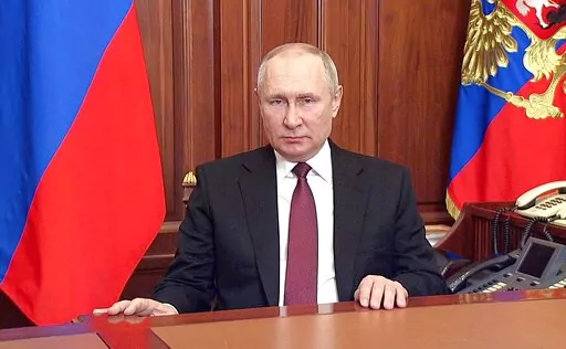 In this image made from video released by the Russian Presidential Press Service, Russian President Vladimir Putin addressees the nation in Moscow, Russia, on Feb. 24, 2022. Putin is raising fears that he has become more reckless, more committed to restoring the USSR, perhaps more likely to set off a world-altering war. There's no way to determine from a distance whether the Russian president is becoming unstable or if he is simply preying on the West's fears. (Russian Presidential Press Service