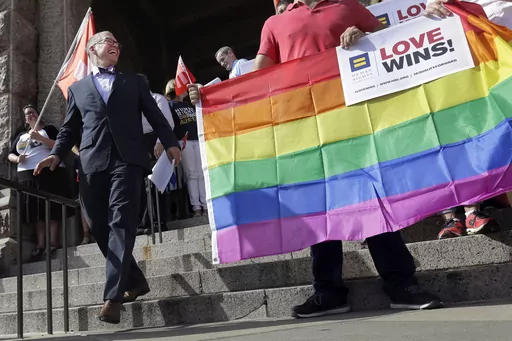 Jim Obergefell, the named plaintiff in the Obergefell v. Hodges Supreme Court case that legalized same sex marriage nationwide, arrives for a news conference on the steps of the Texas Capitol, June 29, 2015, in Austin, Texas. The start of June marks the beginning of Pride month around the U.S. and some parts of the world, celebrating the lives and experiences of LGBTQ+ communities as well as raising awareness about ongoing struggles and pushing back against efforts to roll back civil rights gain