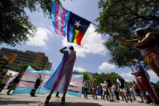 Demonstrators gather on the steps to the State Capitol to speak against transgender-related legislation bills being considered in the Texas Senate and Texas House, May 20, 2021 in Austin, Texas. No texts or emails that leave paper trails. Unusually close oversight. Texas child welfare workers who have quit over Republican Gov. Greg Abbott's first-of-its-kind directive in the U.S. to investigate families of transgender youth for abuse say rushed new protocols appear designed to tilt the outcome o