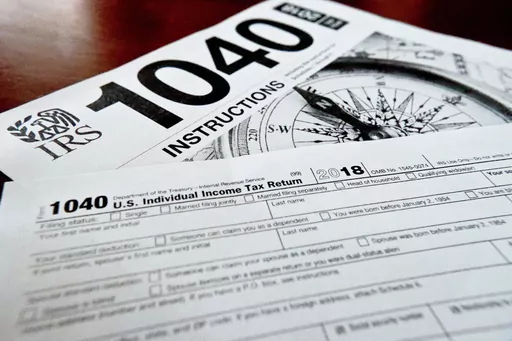 FILE- Internal Revenue Service taxes forms are seen on Feb. 13, 2019. If you have unpaid or unfiled taxes, the start of a new tax season and the looming reminders of debt might fill you with dread. But it’s best to take care of back taxes sooner rather than later: The longer you put off the task, the more you’ll pay in interest and penalties. Even if you can’t pay in full, you can still take meaningful steps toward addressing the debt. To handle your overdue taxes, read any tax notices you