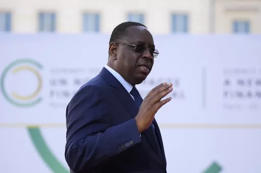 Senegal's President Macky Sall arrives for the closing session of the New Global Financial Pact Summit, Friday, June 23, 2023 in Paris. Senegalese President Sall declared Monday evening, July 3, that he will not run for a third term in next year's elections, ending years of uncertainty over his political future that had helped fuel deadly opposition protests last month. (AP Photo/Lewis Joly, Pool, File)