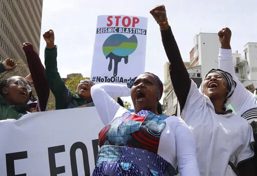 Environmental activists take part in a protest calling for the government to take immediate action against climate change in Cape Town, South Africa, Sept. 24, 2022. Young climate activists from African nations have high demands but low expectations for the U.N. climate conference which begins Sunday, Nov. 6, in the Egyptian coastal resort of Sharm el-Sheikh. (AP Photo/Nardus Engelbrecht, File)