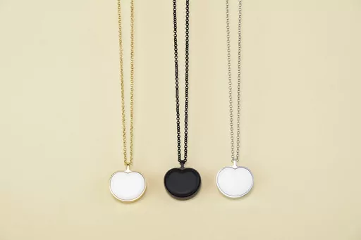 This image provided by Bond-Touch shows the Bond Heart smart necklace, which stores and plays heartbeats with the help of an app. Think outside the box for Mother's Day gifts this year. (Bond-Touch via AP).