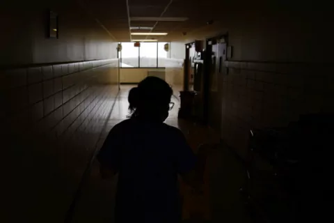 A chief nursing officer walks down a hallway in the recently reopened emergency room at a hospital  in Houma, La., on Friday, Sept. 3, 2021. Patients worried about getting smacked with an unexpected bill after emergency care gained a layer of protection in January 2022 from a new federal law. The No Surprises Act prevents doctors or hospitals in many situations from billing insured patients higher rates because the care providers are not in their insurer’s coverage network. (AP Photo/John Loch