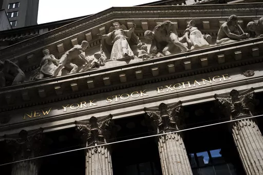 Statues adorn the facade of the New York Stock Exchange Thursday, July 14, 2022, in New York.  Stocks are opening higher on Wall Street, Friday, Sept. 2,  after a solid report on the jobs market last month that also didn't came in too high.(AP Photo/John Minchillo, File)