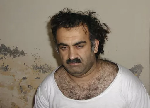 This Saturday March 1, 2003, photo obtained by The Associated Press shows Khalid Shaikh Mohammad, the alleged Sept. 11 mastermind, shortly after his capture during a raid in Pakistan. The suspected architect of the Sept. 11, 2001, attacks and his fellow defendants may never face the death penalty under plea agreements now under consideration to bring an end to their more than decadelong prosecution, the Pentagon and FBI have advised families of some of the thousands killed. (AP Photo)