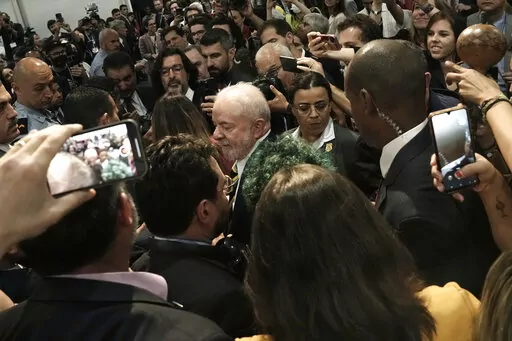 Brazilian President-elect Luiz Inacio Lula da Silva, center, leaves after speaking at the COP27 U.N. Climate Summit, Wednesday, Nov. 16, 2022, in Sharm el-Sheikh, Egypt. (AP Photo/Nariman El-Mofty)