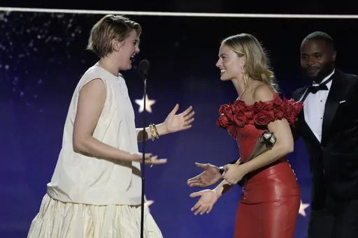 Greta Gerwig, left, and Margot Robbie accept the award for best comedy for "Barbie" during the 29th Critics Choice Awards on Sunday, Jan. 14, 2024, at the Barker Hangar in Santa Monica, Calif. (AP Photo/Chris Pizzello)