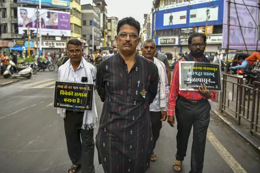 Avinash Patil, center, an activist and leader of the Maharashtra Andhashraddha Nirmulan Samiti, an anti-superstition group, marches on the 10th death anniversary of its founder and renowned rationalist, Narendra Dabholkar, who was gunned down during a morning walk in Pune, India, Sunday, Aug 20, 2023. The nones in India come from an array of belief backgrounds, including Hindu, Muslim and Sikh. The surge of Hindu nationalism has shrunk the space for the nones over the last decade, activists say.