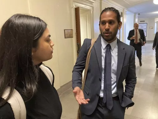 Jay Devineni, right, a student at the University of Missouri School of Medicine, talks with fellow medical school student Supriya Vuda in the hallway of the Missouri Capitol in Jefferson City, Mo., on March 28, 2023. Devineni and Vuda testified against legislation in a Senate committee that would restrict diversity, equity and inclusion initiatives in medical schools and among health care providers. (AP Photo/David A. Lieb)
