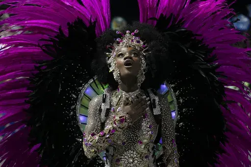 Drum queen Lorena Raissa from Beija-Flor samba school performs during Carnival celebrations at the Sambadrome in Rio de Janeiro, early Tuesday, March 4, 2025. (AP Photo/Bruna Prado)