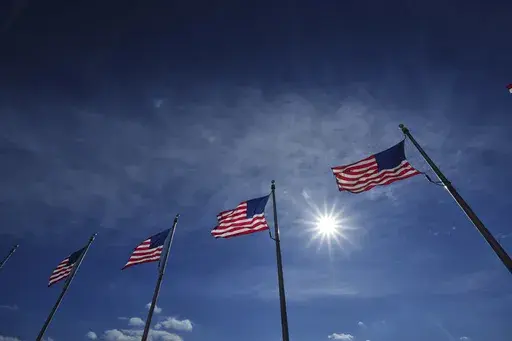 U.S. flags around the Washington Monument are at full staff ahead of the 60th Presidential Inauguration, Monday, Jan. 20, 2025, in Washington. Flags are supposed to fly at half-staff through the end of January out of respect for former President Jimmy Carter, who died Dec. 29, 2024. (AP Photo/Julio Cortez)