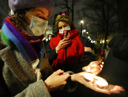 A group of women's rights activists protest against Poland's strict anti-abortion law, outside the top constitutional court, in Warsaw, Poland, Jan. 26, 2022. The government of Poland, where a near-total abortion ban is in place, faced accusations Monday, June 6, 2022, of creating a “pregnancy register” as the country expands the amount of medical data being digitally saved on patients. (AP Photo/Czarek Sokolowski, File)