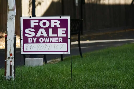For sale by owner sign is displayed outside home in Northbrook, Ill., Wednesday, Sept. 21, 2022. Average long-term U.S. mortgage rates rose this week for the sixth straight week, marking new highs not seen in 15 years, before a crash in the housing market triggered the Great Recession, mortgage buyer Freddie Mac reported Thursday, Sept. 29, 2022. (AP Photo/Nam Y. Huh)
