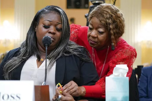 Wandrea "Shaye" Moss, a former Georgia election worker, is comforted by her mother, Ruby Freeman, right, as the House select committee investigating the Jan. 6 attack on the U.S. Capitol continues to reveal its findings of a year-long investigation, at the Capitol in Washington, Tuesday, June 21, 2022. The mother and daughter who were election workers in Georgia brought the sense of danger into stark relief. They testified they feared even to say their names in public after Trump wrongly accused