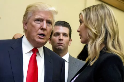 Donald Trump, left, his son Donald Trump Jr., center, and his daughter Ivanka Trump speak during the unveiling of the design for the Trump International Hotel in the The Old Post Office, in Washington, on  Sept. 10, 2013. The former, his namesake son and his daughter have agreed to answer questions under oath next month in the New York attorney general's civil investigation into his business practices, unless their lawyers persuade the state's highest court to step in. A Manhattan judge signed o