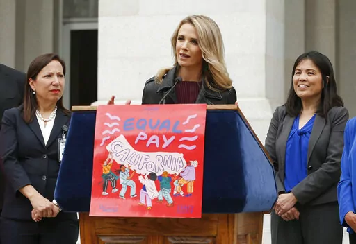 California first partner Jennifer Siebel Newsom, center, wife of Gov. Gavin Newsom, joined others to announce the #EqualPayCA campaign, in Sacramento, Calif., on April 1, 2019. Siebel Newsom, a documentary filmmaker and actor, is among the accusers of Harvey Weinstein who will testify at his rape and sexual assault trial that began Monday, Oct. 10, 2022, her attorney said.  (AP Photo/Rich Pedroncelli, File)