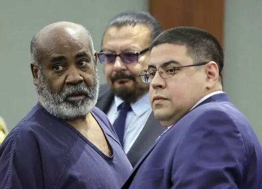Duane "Keffe D" Davis, left, with deputy special public defenders Robert Arroyo, right, and Charles Cano, rear, appears for his arraignment at the Regional Justice Center, Nov. 2, 2023, in Las Vegas. The former Los Angeles-area gang leader accused of murder in the killing of hip-hop music icon Tupac Shakur in 1996 in Las Vegas is seeking to be released to house arrest ahead of his murder trial in June 2024. A Nevada judge on Tuesday, Dec. 19, 2023, set a Tuesday, Jan. 2, 2024, hearing on the req